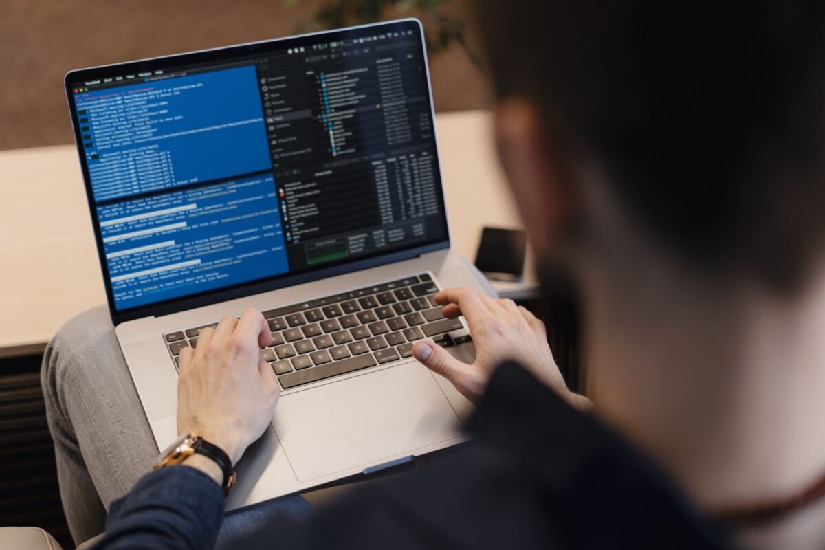 Man writing code on the laptop