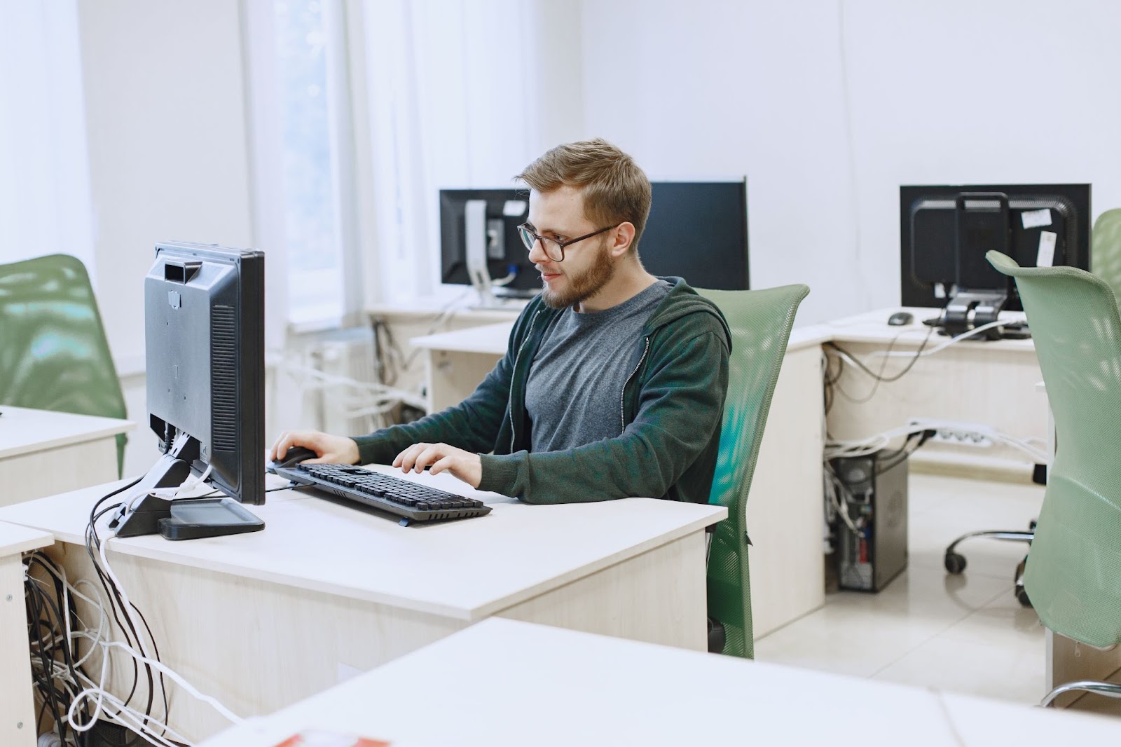 A man works at his computer