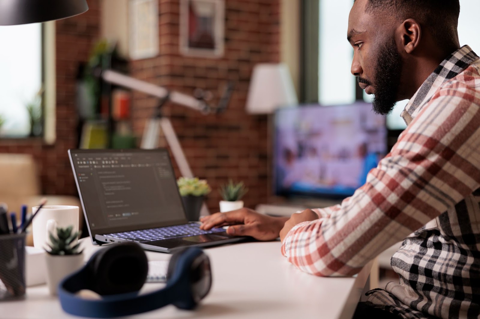 A man works at his computer